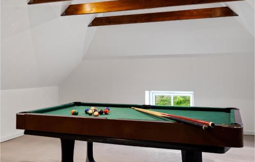 a pool table with billiard balls on top of it at Lovely Home In Tim With Sauna in Halkær