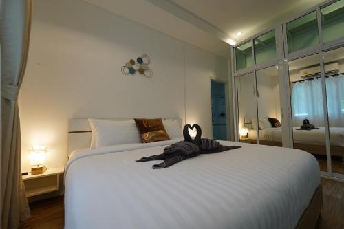 Una cama o camas en una habitación de Tropical Oasis Aoyon Beach House