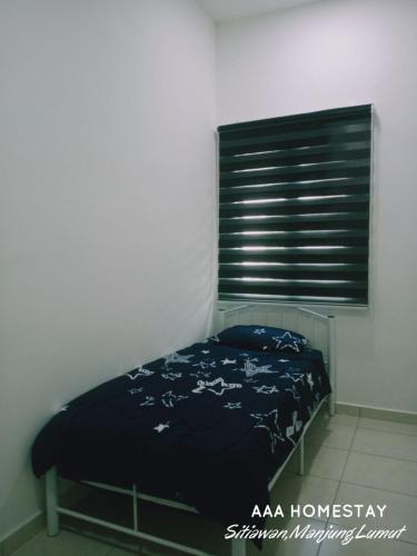 Ένα ή περισσότερα κρεβάτια σε δωμάτιο στο AAA homestay