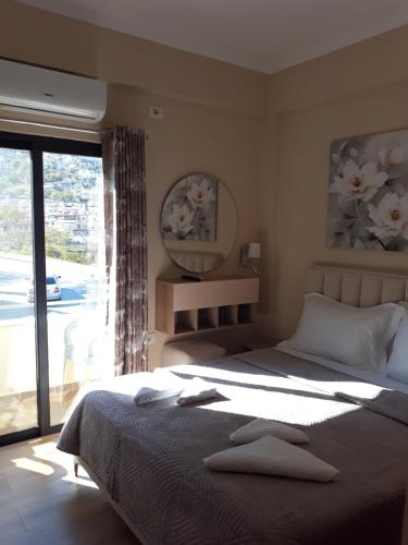 Postel nebo postele na pokoji v ubytování Qiqi Hotel