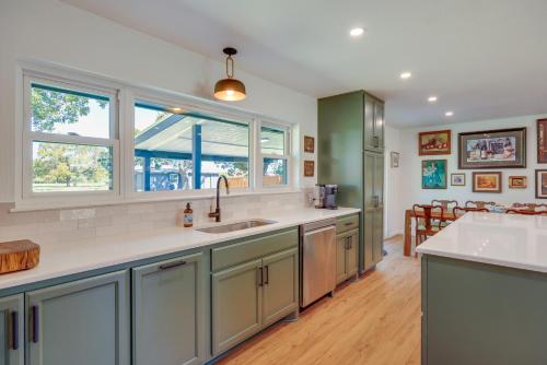 a kitchen with a sink and a counter at BBQ Ready and Fire Pit Chic Johnson City Home in Johnson City