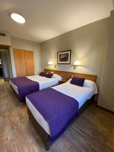 Ένα ή περισσότερα κρεβάτια σε δωμάτιο στο Hotel Centro