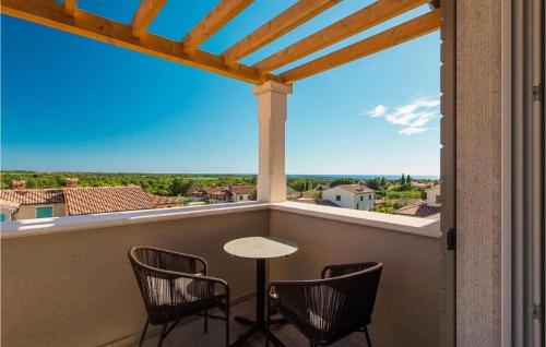 a balcony with chairs and a table and a view at Villa Fendt 2 in Poreč