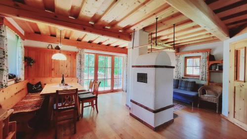 a kitchen with a table and a stove in a room at Stodertraum 5 "Schlüsselblume" by Alpenidyll Apartments in Weyern