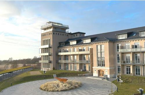 a large building with a bowl in front of it at Boddensonne in der Alten Seefahrtschule in Wustrow
