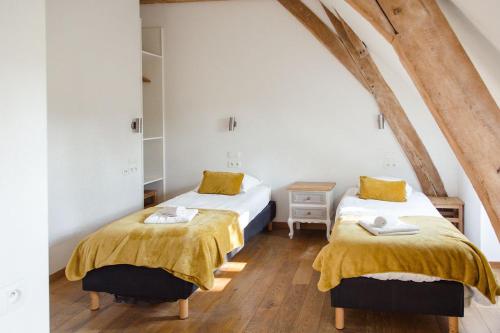 Postel nebo postele na pokoji v ubytování B&B La Ferme de l'Hosté