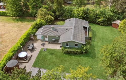 an aerial view of a house with a backyard at Lovely Home In Tranekær With Sauna in Tranekær