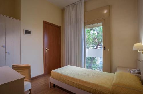 Postel nebo postele na pokoji v ubytování Hotel B&B Risorta