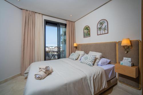 Voodi või voodid majutusasutuse Gauthier Luxe , 1BR Apart- Comfort & Style in Casa toas