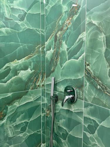 a bathroom with a shower with a glass wall at Il Ritrovo Spa&Rooms in Naples
