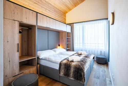 Postel nebo postele na pokoji v ubytování SWISSPEAK Resorts Thyon 4 Vallées