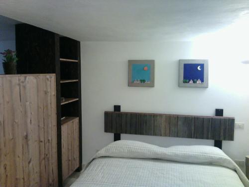 En eller flere senge i et værelse på Trulli & Grotte Exclusive House
