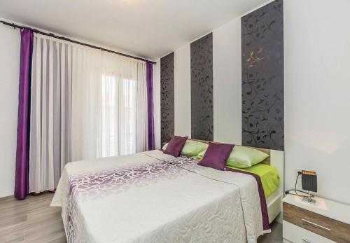 Posteľ alebo postele v izbe v ubytovaní Apartments Ivni