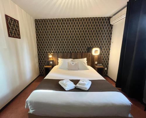 Ένα ή περισσότερα κρεβάτια σε δωμάτιο στο FastHôtel Mont de Marsan - Un Hôtel FH Collection