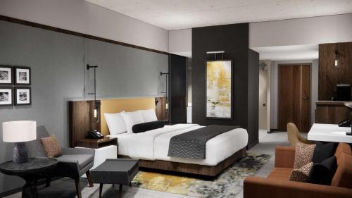 a bedroom with a bed and a living room at Black Desert Resort in Ivins