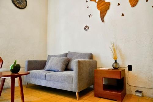 a living room with a couch and a table at Casona enfrente del Santuario 2 in Guadalajara