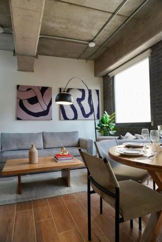 a living room with a couch and a table at LEF 505 Zona Americana in Guadalajara