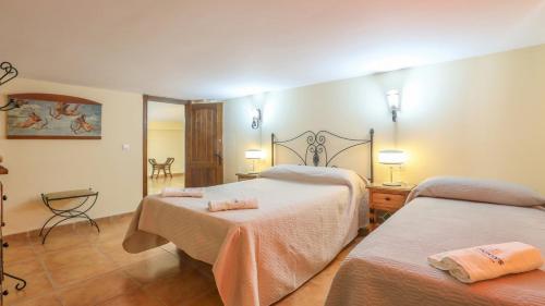 Un ou plusieurs lits dans un hébergement de l'établissement La Cabaña La Carlota by Ruralidays