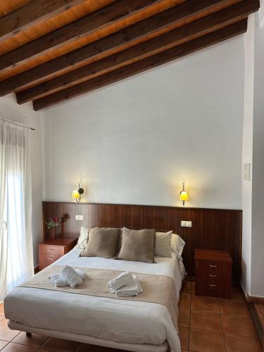 Postel nebo postele na pokoji v ubytování Hostal Camarina