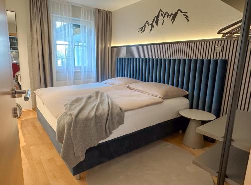 Postel nebo postele na pokoji v ubytování "SONNTAGSGLÜCK" - Premium Apartments Seekirchen, ruhiges Feriendomizil im Grünen, gemeinsamer Poolarea