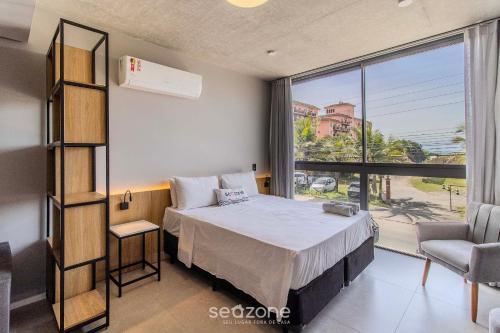 Cama o camas de una habitación en Spot Jurere sofisticación junto al mar - SPJ's