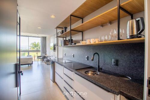 Una cocina o zona de cocina en Spot Jurere sofisticación junto al mar - SPJ's