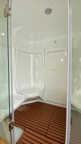 an open door of a small white refrigerator at SIENNA Hotel in Rio Maior