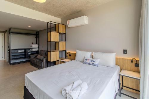 Cama o camas de una habitación en Spot Jurere sofisticación junto al mar - SPJ's