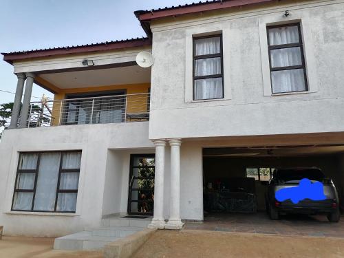 a car parked in the garage of a house at Sibusisiwe in Acornhoek