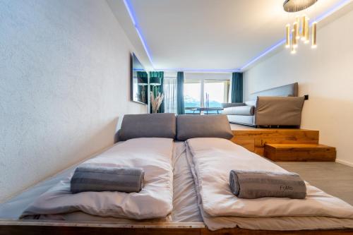 Postel nebo postele na pokoji v ubytování Traumwohnung in Interlaken inklusive SPA-Bereich