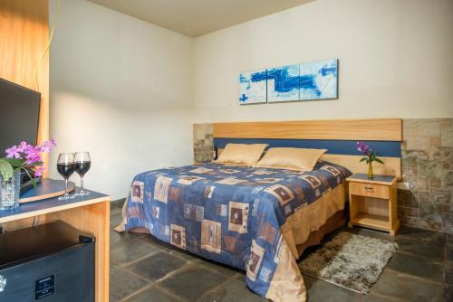 Giường trong phòng chung tại Hotel Fazenda Reviver