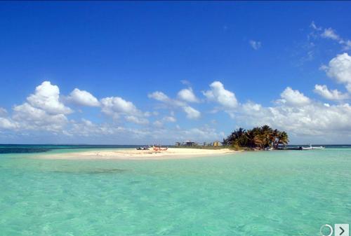 a small island in the middle of the ocean at Ti COCO in Sainte-Rose