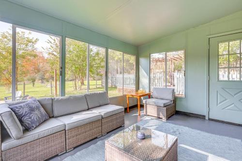 a living room with a couch and a chair at Sand Lake Retreat Canal Access and Large Yard! in Tipton