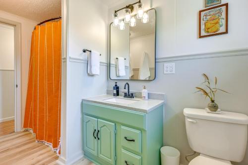 a bathroom with a sink and a mirror at Sand Lake Retreat Canal Access and Large Yard! in Tipton