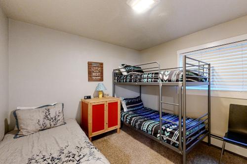 a bedroom with two bunk beds and a bed at Summit Serenity in Dillon