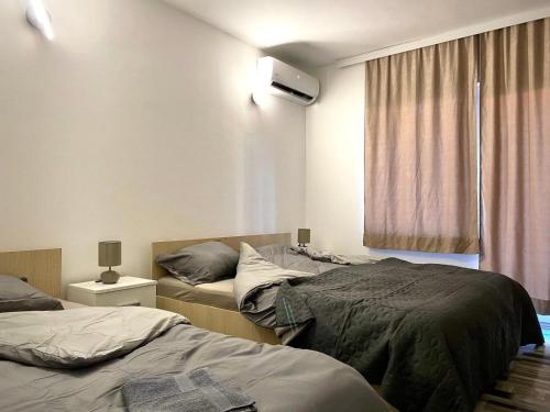 Una cama o camas en una habitación de Studio Banjica