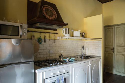 a kitchen with a sink and a stove at CRISPI DELUXE 2 bedroom in Rome