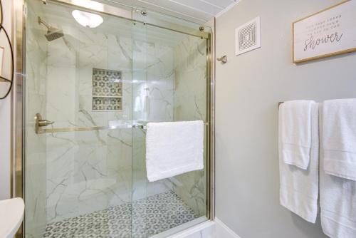 a shower with a glass door in a bathroom at Gilford Townhome with Lakefront Beach and Pool Access! in Gilford
