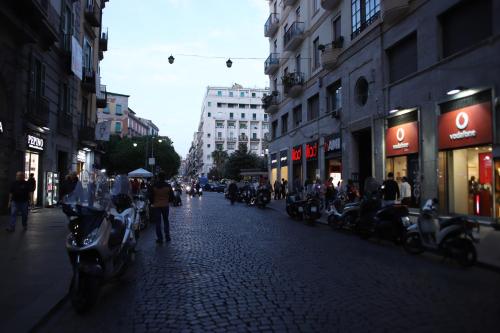 a street with motorcycles parked on the side of the road at Il Ritrovo Spa&Rooms in Naples