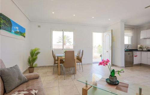 a living room with a couch and a table at Cozy Home In El Chaparral in La Mata