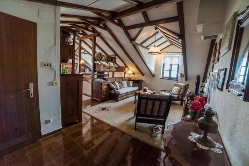 a living room with a table and chairs in a room at Apartments Ela in Sutivan