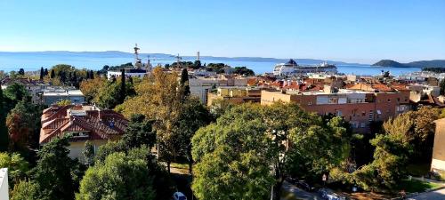 an aerial view of a city and the water at Apartment 28 in Split
