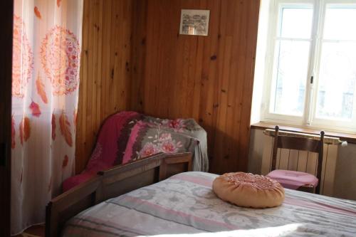 a bedroom with a bed with a donut on it at Studio convivial à Gérardmer, 35 m² avec vue sur la montagne in Gérardmer
