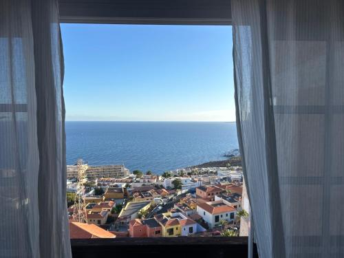 a view of the ocean from a hotel window at Tabaiba views in Tabaiba