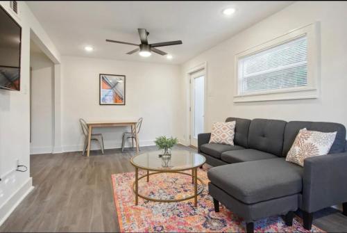 a living room with a couch and a table at Cute 1bed 1bath walk to French Q and Bourbon St in New Orleans