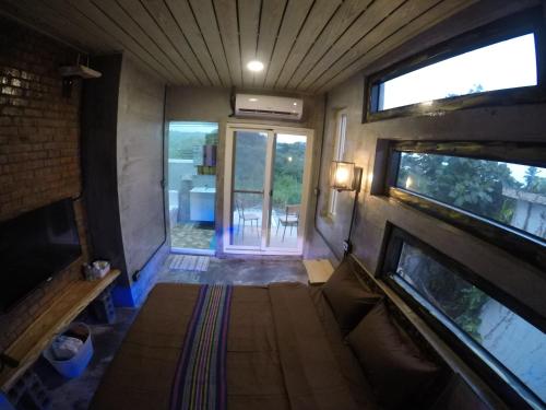 an inside view of a tiny house with a living room at 巴斯拉岸民宿 in Chenggong