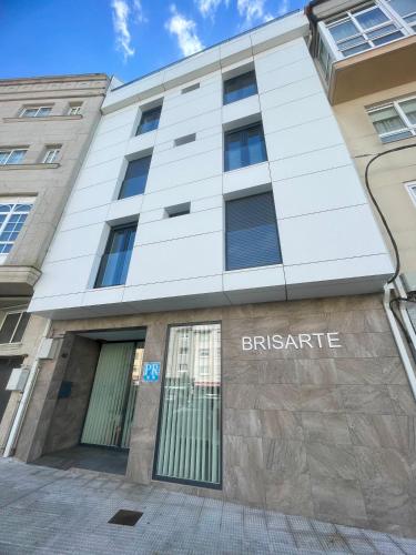 a building with the entrance to the british gate at Brisarte in Arteixo