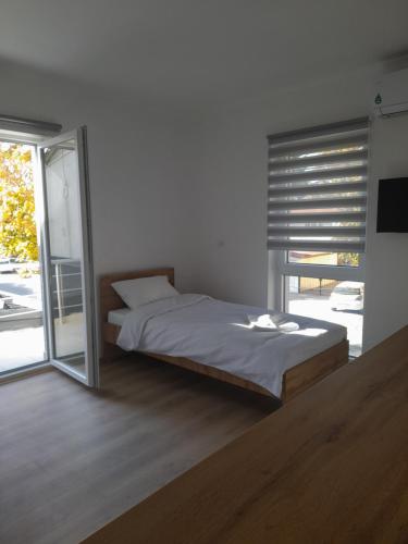 Una cama o camas en una habitación de Phoenix Apartments