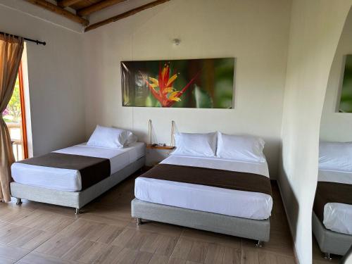 Hotel La Aldea Pijaoにあるベッド