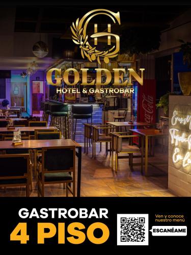 a restaurant with tables and a sign in the background at HOTEL GOLDEN CARTAGO in Cartago